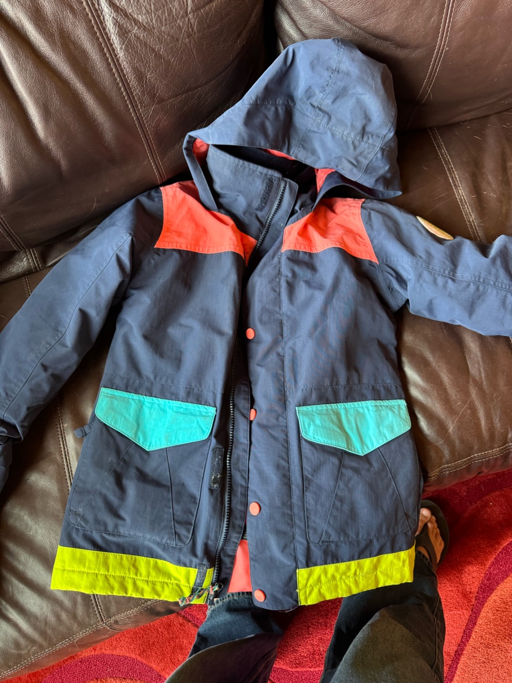 Burton Kids Navy Jacket with Teal Pockets and Orange Accents